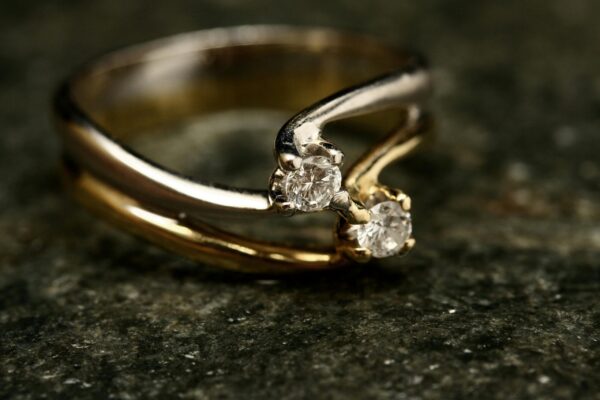 Elegant Gold Ring With Diamond Accents